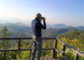 Full day bird watching tour in Chiang Dao forest with birdwatchers using binoculars in misty trail